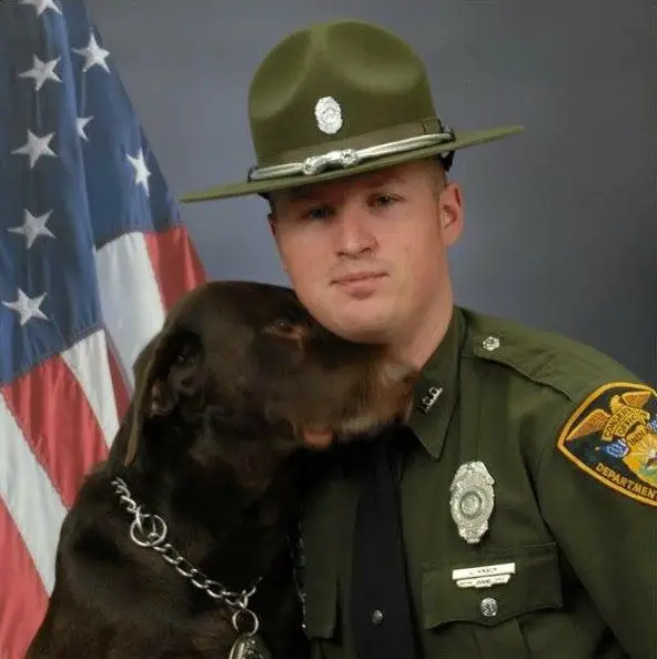 dog kisses soldier