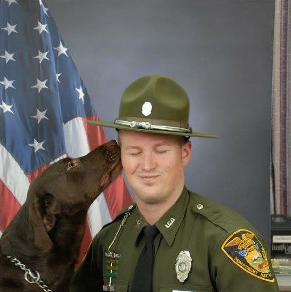 dog kisses soldier