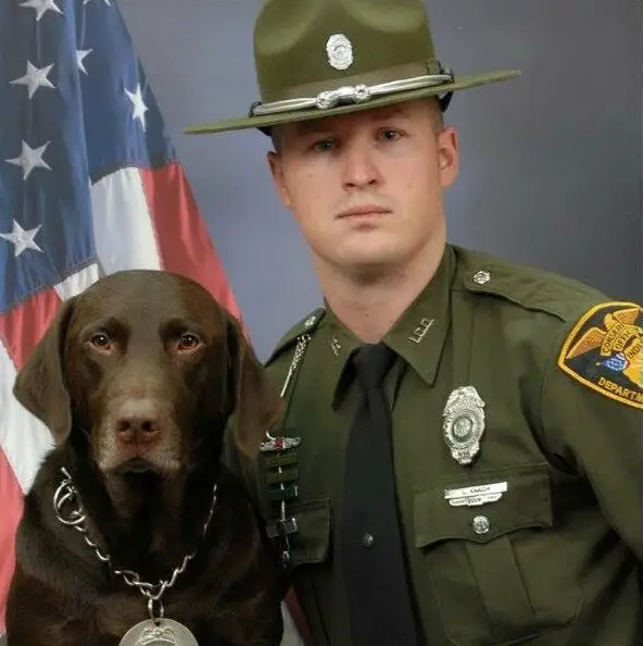 dog kisses soldier