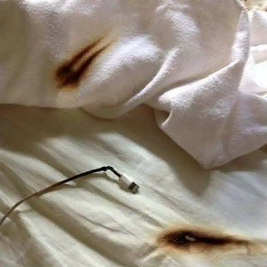 phone charging on bed
