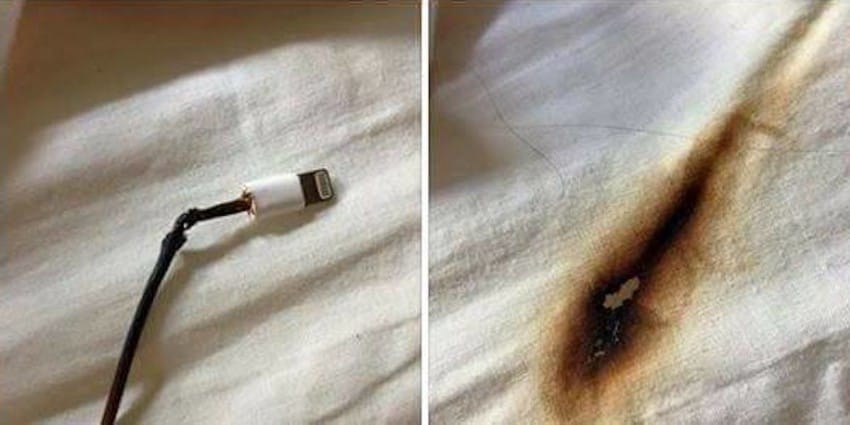 phone charging on bed