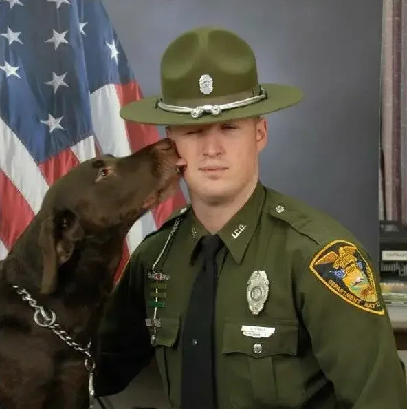 dog kisses soldier