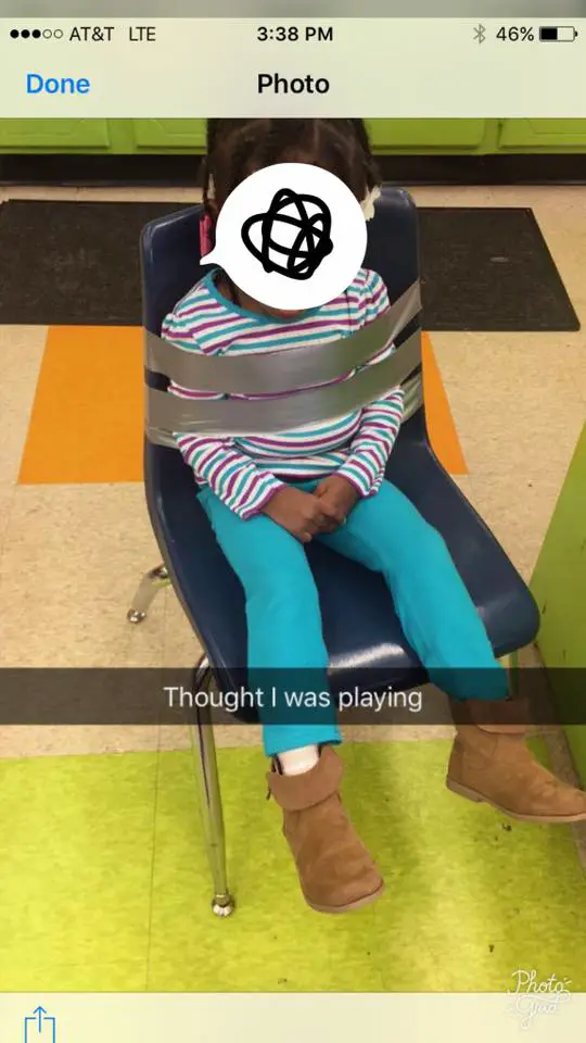 child duct taped to chair