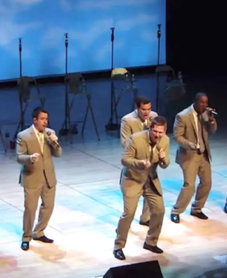men singing and dancing