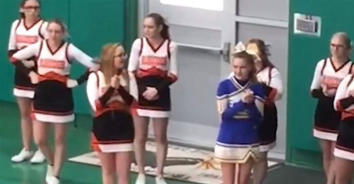 cheerleaders-surround-girl-rival