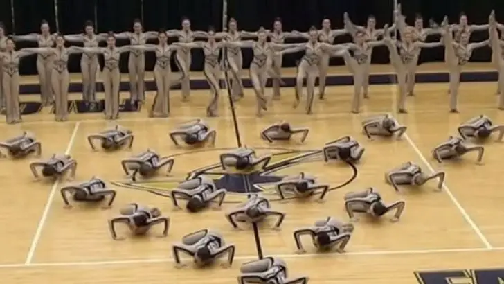 dancers stand in huge circle