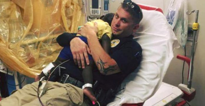 police-officer-cuddling-abandoned-toddler