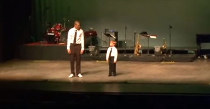 small-boy-stares-at-tap-instructor