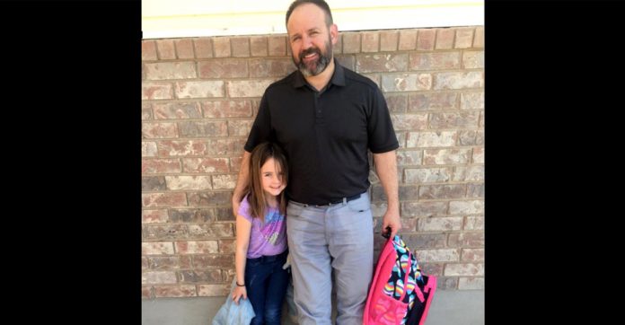 dad-comforts-6-year-old-daughter