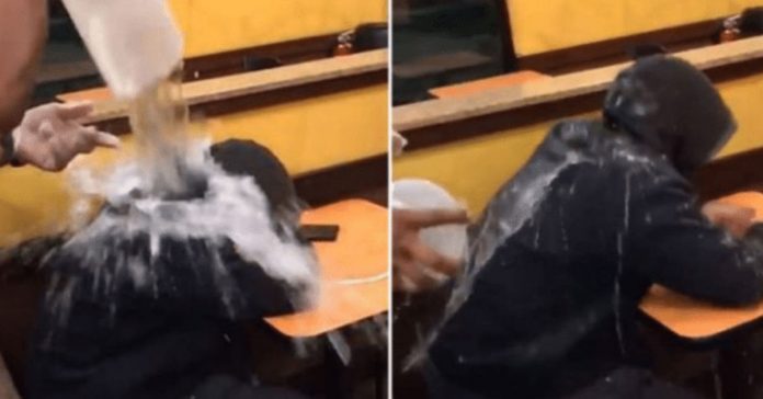 employee-pours-water-homeless-man employee pours water homeless man
