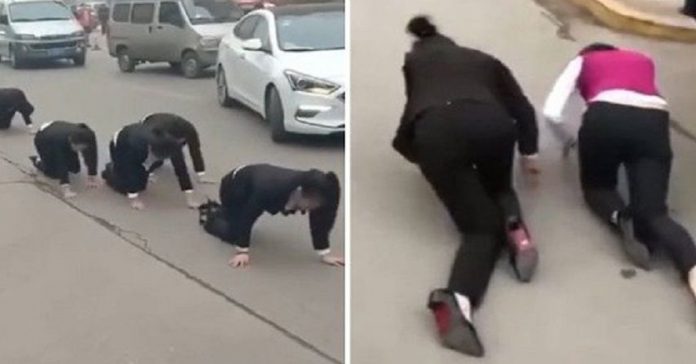employees-forced-to-crawl-street employees forced to crawl street