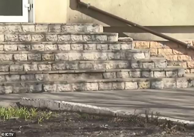 father throwing daughter stairs